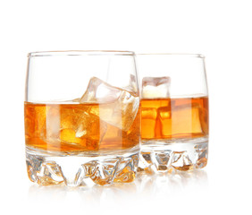 Brandy glasses with ice isolated on white