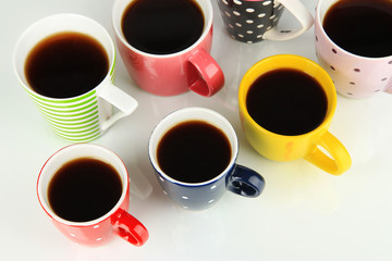 Many cups of coffee isolated on white