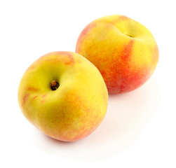 Ripe sweet peaches, isolated on white