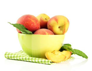 Ripe sweet peaches in bowl, isolated on white