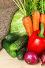 Fresh vegetables on wooden table close up