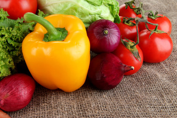 Fresh vegetables on burlap background