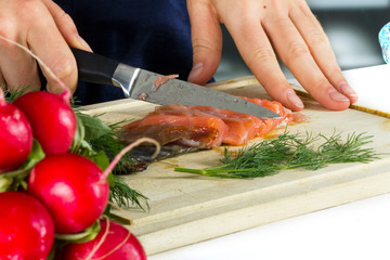 Woman cooking fish