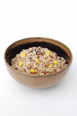 cooked mixed rice in ceramic bowl on white background
