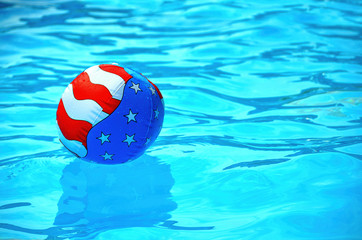 patriotic beach ball in pool