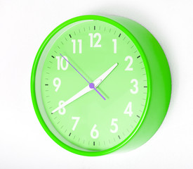 A blue wall clocks on white ground