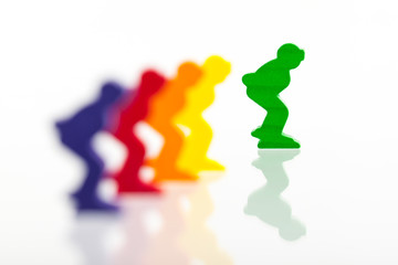 Five colored pawns isolated on a white background