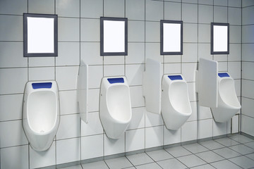 modern restroom interior with urinal row