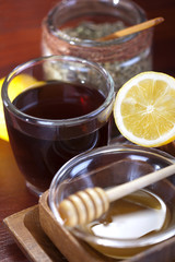 Tea cup with lemon and honey