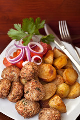 meatballs served with potatoes