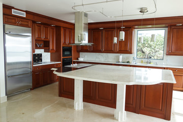 Modern, upscale kitchen with marble counter top
