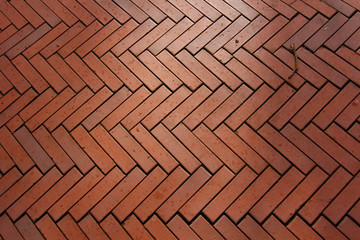 background made with red bricks in a herringbone