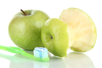 Apples with a toothbrush isolated on white