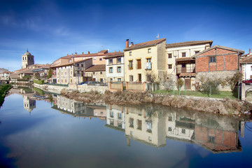 Fototapeta na wymiar Landscape of river and village in Aguilar de Campo, famous for i