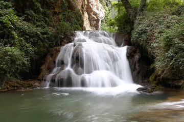 cascade over small lagoon