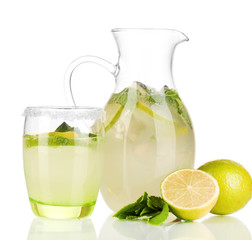 Lemonade in pitcher and glass isolated on white