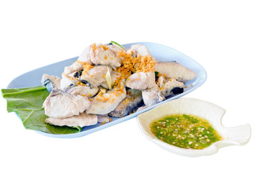 Steamed snapper with dipping sauce isolated on white