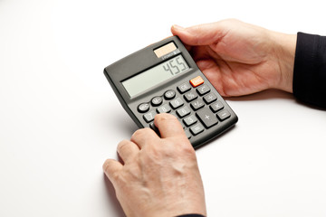 Hands with calculator