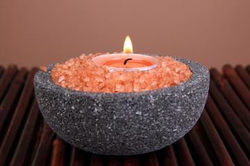 Candle in stone bowl with marine salt,