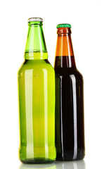 Bottles of beer on light background