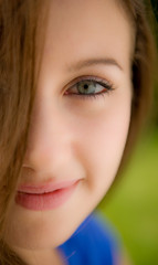 Half Face Portrait Of Beautiful Young Woman