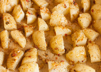 Sliced potatoes with spices, to bake