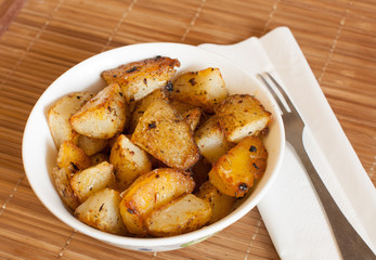 Baked potatoes in a rural, in a bowl on a napkin