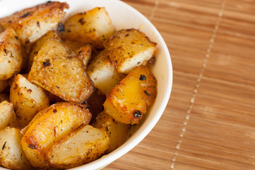 Baked potatoes in a rural, in a bowl on a napkin. close-up