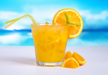 Summer drink with blur beach on background