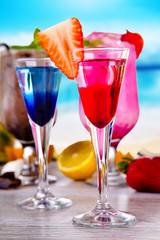 Summer drinks with blur beach on background