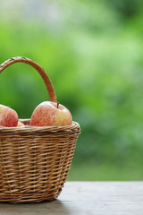 gala apples in a wicker basket