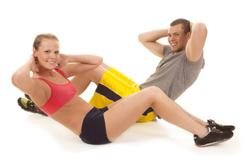 Obraz na płótnie Canvas couple fitness doing crunches