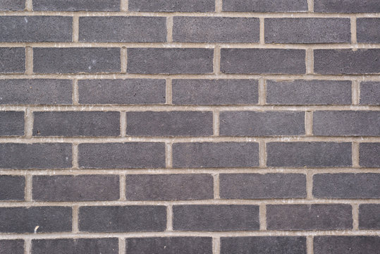 Black brick wall composition