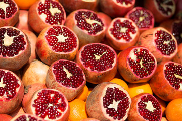 Many fresh pomegranates on market