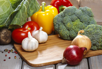 Group of fresh vegetables on wooden table. Copy space.
