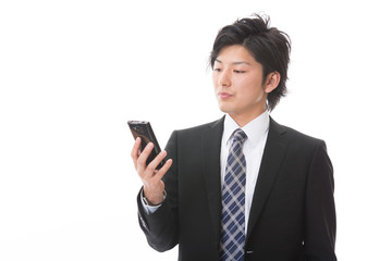 ビジネスマン　スマートフォン