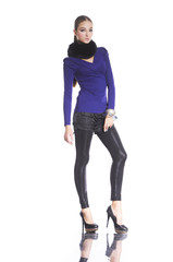 Fototapeta premium portrait of a pretty young woman in scarf standing posing