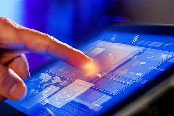 Closeup of finger touching tablet-pc screen