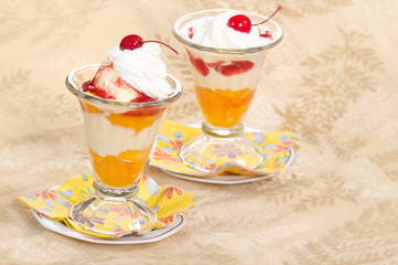 Peach melba ice cream with whipped cream
