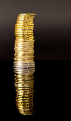 Coin tower over black