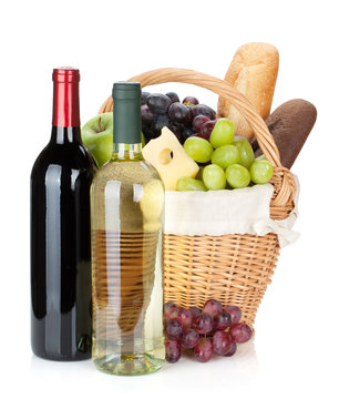 Picnic Basket With Bread, Cheese, Grape And Wine Bottles