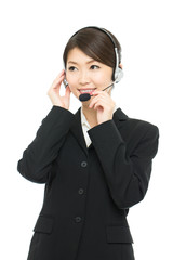 Beautiful asian business operator isolated on white background