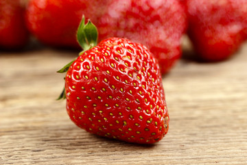 Fresh strawberries on wooden background