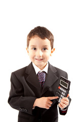 Small boy in dark suit with calculator