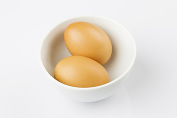 Boiled eggs in white bowl