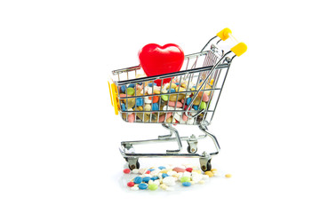 shopping trolley with pills,heart  isolated on white background