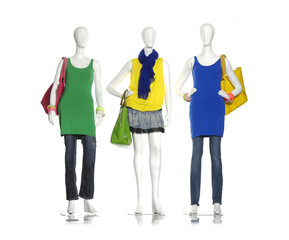 Obraz premium female colorful dress with bag ,scarf, on three mannequin