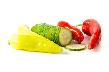 chilli and cucumber isolated on white background