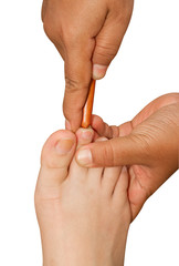 Reflexology foot massage, thai spa foot treatment by wood stick