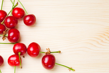 Cherries on wooden table